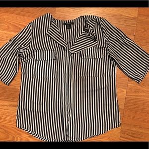 A 3/4 sleeve navy blue and white stripped blouse